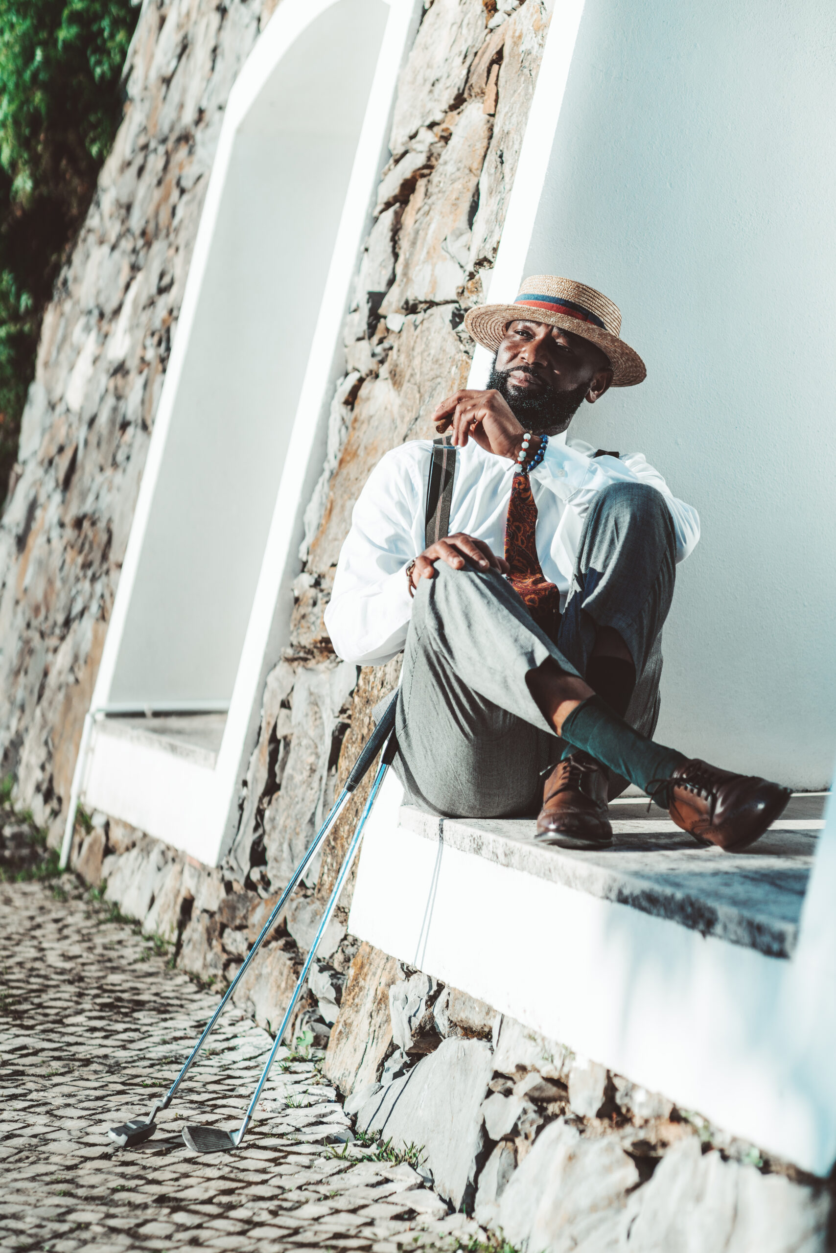Black man resting after a golf play
