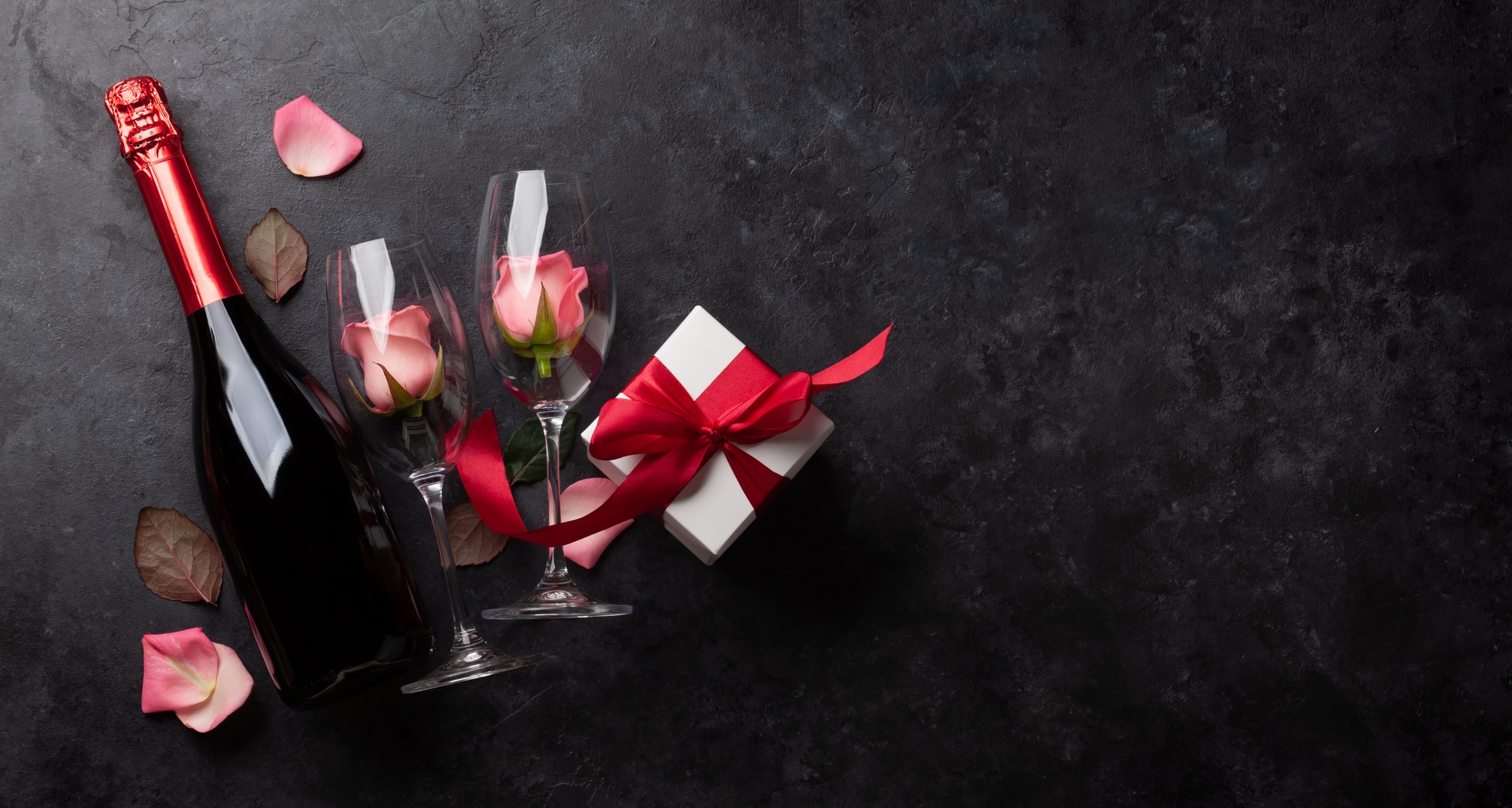 Champagne bottle and rose flowers
