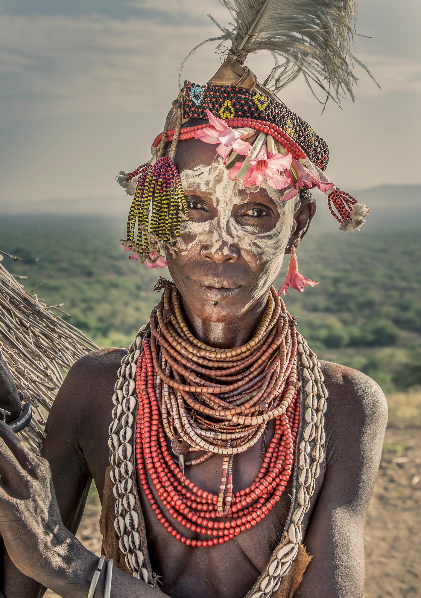 Portrait of mature woman from Karo tribe wearing traditional costume, Ethiopia, Africa Portrait of mature woman from Karo tribe wearing traditional costume, Ethiopia, Africa